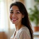 A happy woman in her late 30s, Sato Yuki, working from a home office.